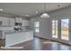 Modern kitchen with island, stainless steel appliances, and hardwood floors at 3913 Coleman Dr, Charlotte, NC 28215