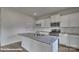 Modern kitchen with white cabinets, granite countertops, and hardwood floors at 3913 Coleman Dr, Charlotte, NC 28215