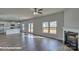 Open living room and kitchen area with hardwood floors and fireplace at 3913 Coleman Dr, Charlotte, NC 28215