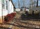 Landscaped backyard with retaining wall and shed at 401 Gillscreek Dr, Lancaster, SC 29720