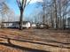 Single-story home on wooded lot with detached building at 401 Gillscreek Dr, Lancaster, SC 29720