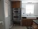 Double oven and farmhouse sink in updated kitchen at 401 Gillscreek Dr, Lancaster, SC 29720