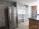 Stainless steel refrigerator and ample kitchen shelving at 401 Gillscreek Dr, Lancaster, SC 29720