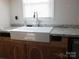 Farmhouse sink with granite countertop and cabinets at 401 Gillscreek Dr, Lancaster, SC 29720