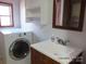 Laundry room with washer, dryer, and vanity sink at 401 Gillscreek Dr, Lancaster, SC 29720