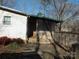 Side entrance with paved walkway and brick wall at 401 Gillscreek Dr, Lancaster, SC 29720