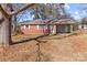 Brick ranch house with covered porch and large tree in front yard at 437 E 22Nd St, Kannapolis, NC 28083