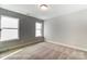 This bedroom features neutral walls, carpet flooring, and two windows at 5108 Verona Rd # 94, Charlotte, NC 28213