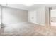 This bedroom features neutral walls, carpet flooring, a closet, and an adjacent room at 5108 Verona Rd # 94, Charlotte, NC 28213