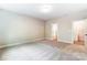Bedroom featuring neutral walls, carpet, and a doorway to an ensuite bathroom at 5108 Verona Rd # 94, Charlotte, NC 28213