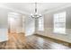 Bright dining room with wood floors, wainscoting, and ample natural light at 5108 Verona Rd # 94, Charlotte, NC 28213