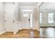 Inviting foyer with stylish wood-look floors and classic trim details at 5108 Verona Rd # 94, Charlotte, NC 28213