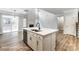 Bright, open kitchen with white cabinets, stainless steel appliances and large island at 5108 Verona Rd # 94, Charlotte, NC 28213