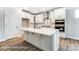 Beautiful kitchen featuring a center island, white cabinets, and stainless appliances at 5108 Verona Rd # 94, Charlotte, NC 28213