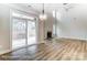 Living room with sliding glass doors, fireplace, and windows for ample natural light at 5108 Verona Rd # 94, Charlotte, NC 28213
