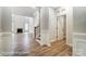 Bright living room featuring wood floors, a fireplace, and staircase access at 5108 Verona Rd # 94, Charlotte, NC 28213