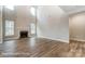 Spacious living room with fireplace and many large windows for ample natural light at 5108 Verona Rd # 94, Charlotte, NC 28213
