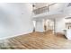 Open-concept living space featuring kitchen and fireplace, flooded with natural light at 5108 Verona Rd # 94, Charlotte, NC 28213