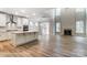 Open concept living room and kitchen with island, fireplace and great natural light at 5108 Verona Rd # 94, Charlotte, NC 28213