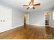 Bright bedroom featuring hardwood floors and en-suite bathroom at 521 Mountainview Dr, Charlotte, NC 28270