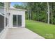 Spacious backyard with lush green grass and a concrete patio, perfect for outdoor entertaining at 5219 Reedy Ridge Rd, Charlotte, NC 28215