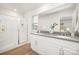 Bathroom featuring double sinks, a large mirror, and a glass-enclosed shower at 5219 Reedy Ridge Rd, Charlotte, NC 28215