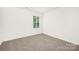 Carpeted bedroom provides natural light at 5219 Reedy Ridge Rd, Charlotte, NC 28215