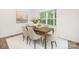 Inviting dining room with a wooden table, comfortable chairs, and ample natural light at 5219 Reedy Ridge Rd, Charlotte, NC 28215