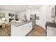 Spacious kitchen with white cabinets, stainless steel appliances, and an open layout at 5219 Reedy Ridge Rd, Charlotte, NC 28215