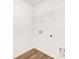 A conveniently located laundry room features connections, storage and durable wood-look floors at 5219 Reedy Ridge Rd, Charlotte, NC 28215