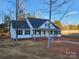 Newly constructed home features a charming front porch and brick accents at 522 Birdie Haven Dr # 27, Chester, SC 29706