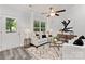 Cozy living room featuring a comfortable sofa, stylish rug, and ample natural light at 5615 Howard St, Charlotte, NC 28269