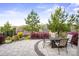 Gorgeous outdoor patio with dining and fire pit offers serene neighborhood views at 6289 Raven Rock Dr, Denver, NC 28037