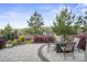 Scenic back patio with ample seating, lush landscaping, and panoramic neighborhood views at 6289 Raven Rock Dr, Denver, NC 28037