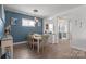 Inviting dining room with modern lighting fixtures and views of a well-appointed bar area at 6289 Raven Rock Dr, Denver, NC 28037