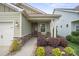 Welcoming front porch with rocking chairs and decorative landscaping offering great curb appeal at 6289 Raven Rock Dr, Denver, NC 28037