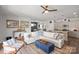 Spacious living room with comfortable seating, modern decor, and access to the kitchen and dining area at 6289 Raven Rock Dr, Denver, NC 28037