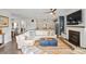 Inviting living room with modern fireplace, open to the kitchen, offering comfortable seating and stylish decor at 6289 Raven Rock Dr, Denver, NC 28037