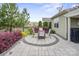 Back patio offers mature landscaping with privacy, an outdoor dining set and beautiful plantings at 6289 Raven Rock Dr, Denver, NC 28037