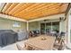 Private back patio with covered seating area and BBQ, perfect for entertaining Gathering and friends at 6289 Raven Rock Dr, Denver, NC 28037