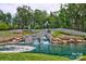 Trilogy community entrance featuring a waterfall feature and lush landscaping at 6289 Raven Rock Dr, Denver, NC 28037
