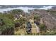 Stunning aerial view of homes surrounded by lush trees and a sparkling lake in the background at 704 Kenway Loop, Mooresville, NC 28117