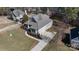 An aerial view of a well-manicured property with a spacious driveway and lush landscaping at 704 Kenway Loop, Mooresville, NC 28117
