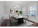 Formal dining room featuring elegant lighting, neutral decor, and a stylish table with seating for six at 704 Kenway Loop, Mooresville, NC 28117