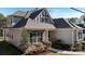 Close-up of the home's front exterior, showcasing its stone accents, siding, and inviting front porch at 704 Kenway Loop, Mooresville, NC 28117