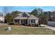Charming two-story home featuring a stone and siding facade, well-maintained landscaping, and a welcoming entrance at 704 Kenway Loop, Mooresville, NC 28117