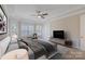 Cozy main bedroom with a bay window, tray ceiling, and ample space for relaxation and comfort at 704 Kenway Loop, Mooresville, NC 28117