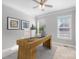 Home office featuring a modern desk, comfortable chair, and natural light from the window at 704 Kenway Loop, Mooresville, NC 28117