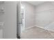 Walk-in closet with carpet floors, metal shelving and access to the bathroom at 704 Kenway Loop, Mooresville, NC 28117