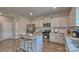 Kitchen with island, stainless steel appliances, and hardwood floors at 8042 Kennesaw Dr, Gastonia, NC 28056